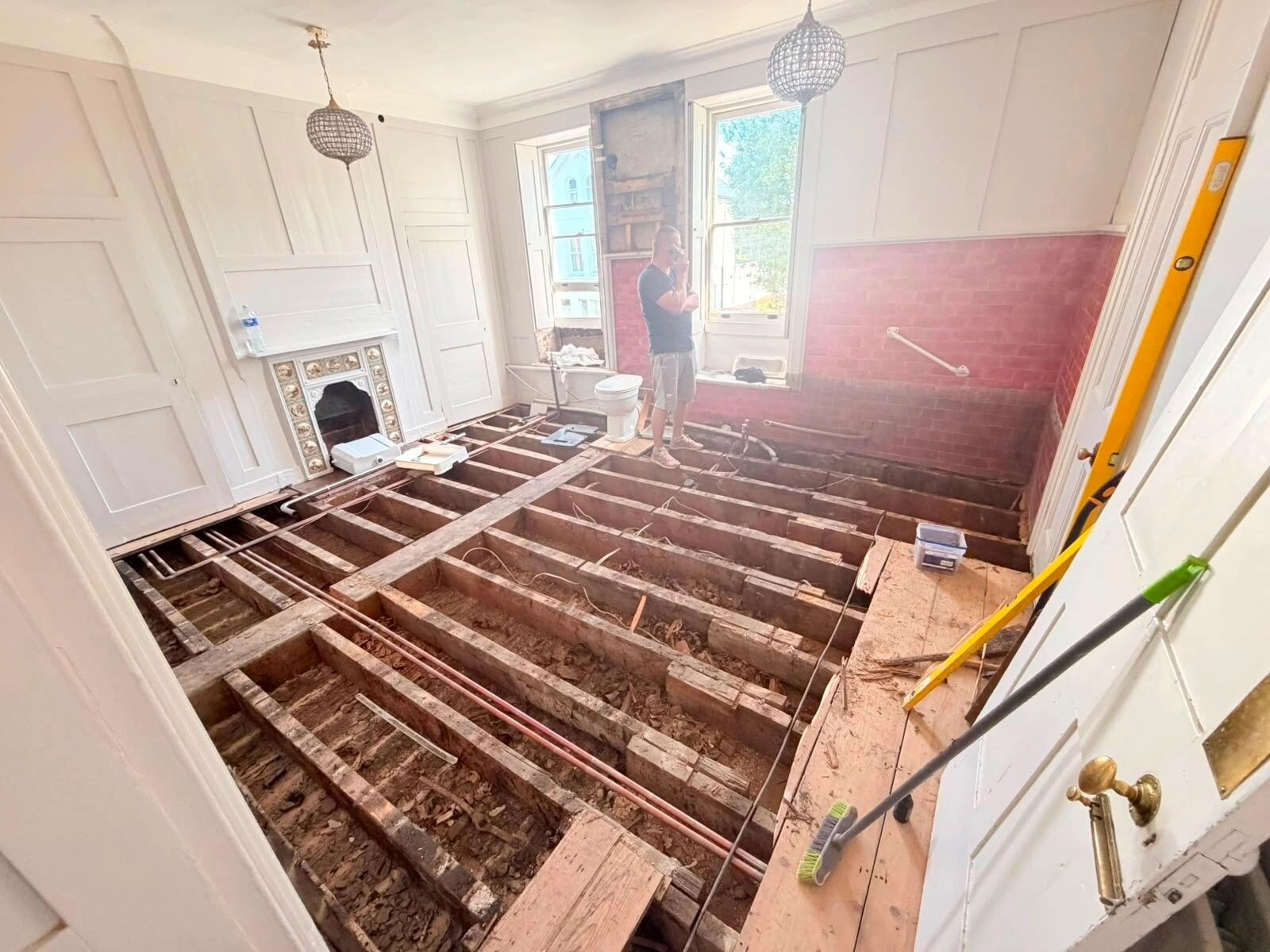 Bathroom strip-out work in a Chertsey listed property.