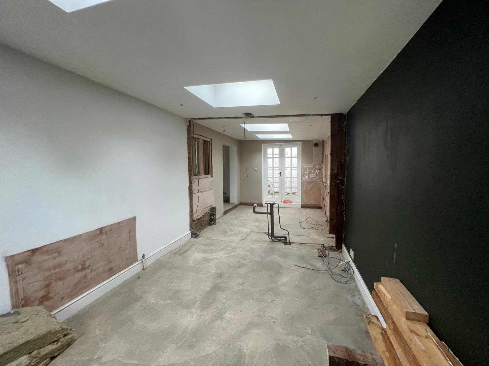 Cleared interior following strip-out at the Clapham flat.