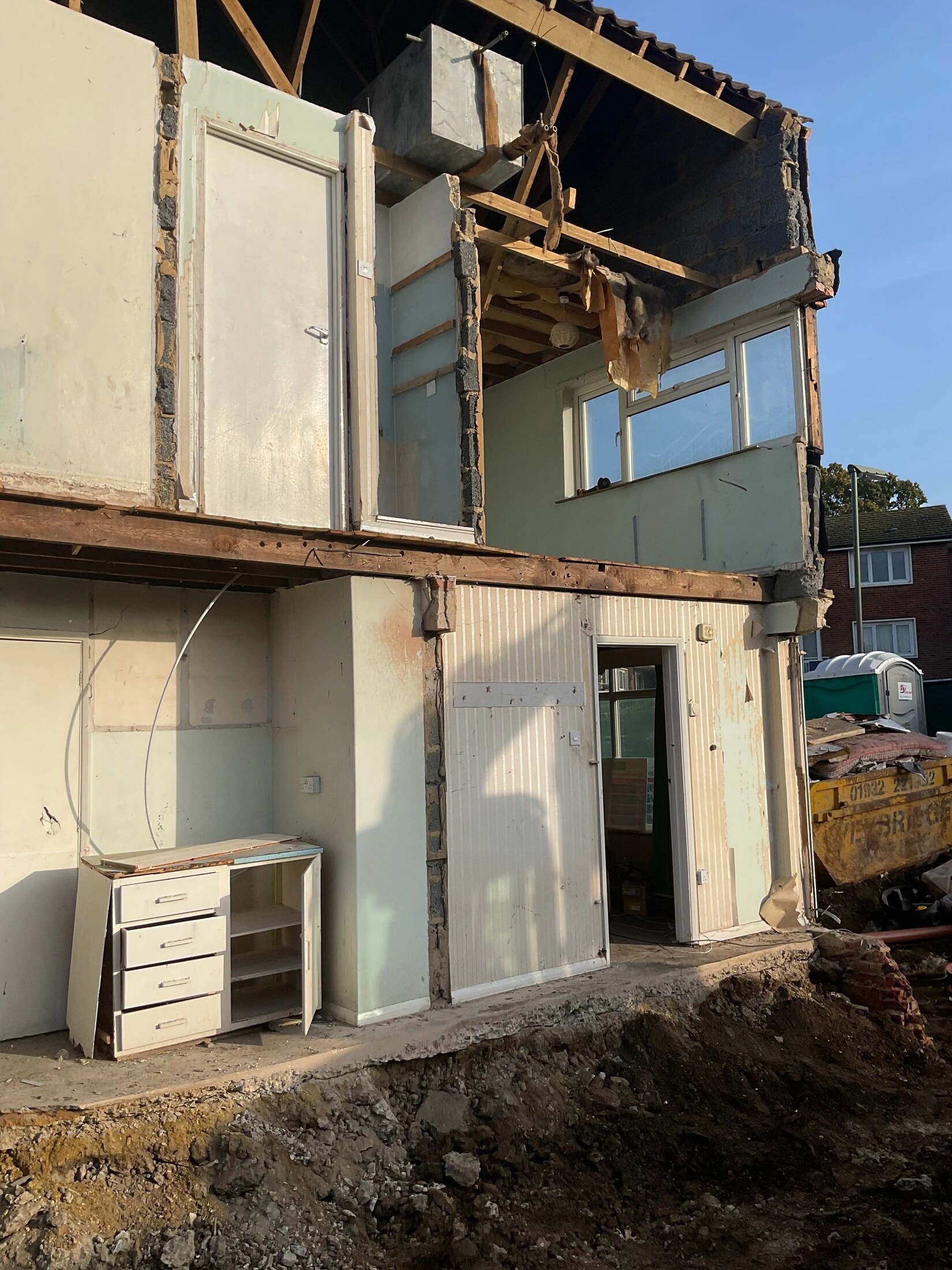 Partial house demolition work in Esher.