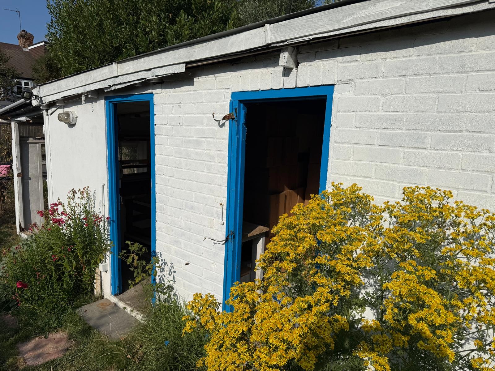 Detached garage in Kingston before clearance and demolition.