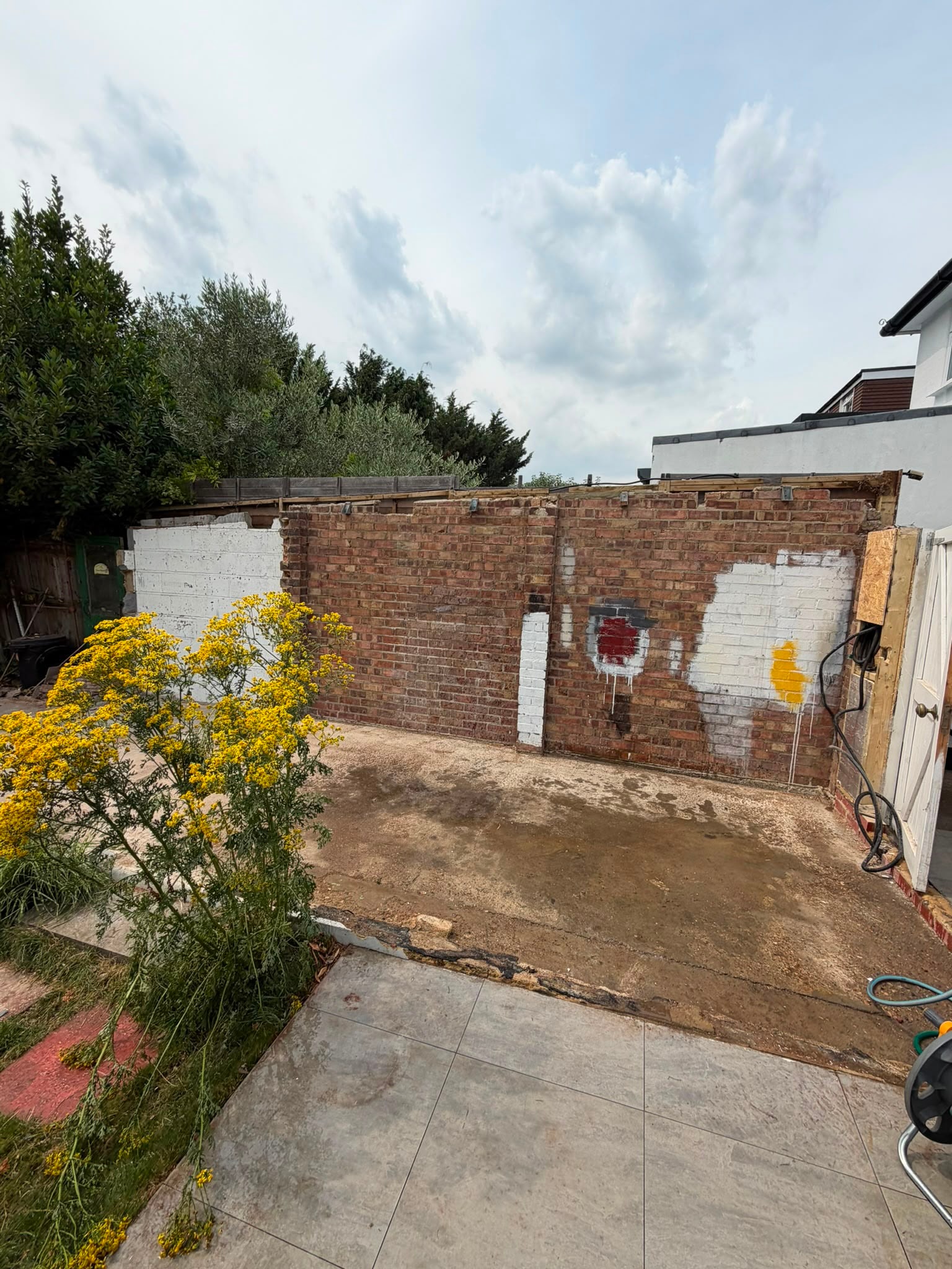 Garage demolition in progress in Kingston.