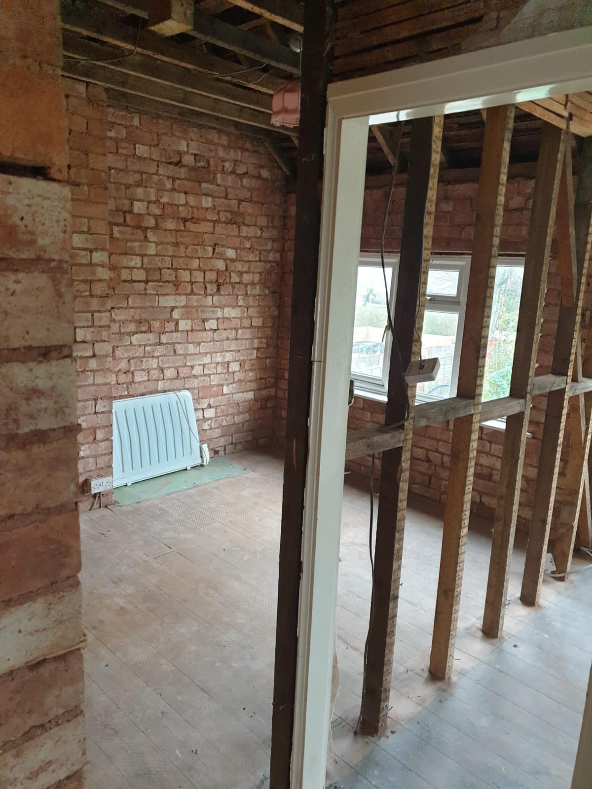 Partitions and studwork exposed during strip-out in the London Victorian terrace.