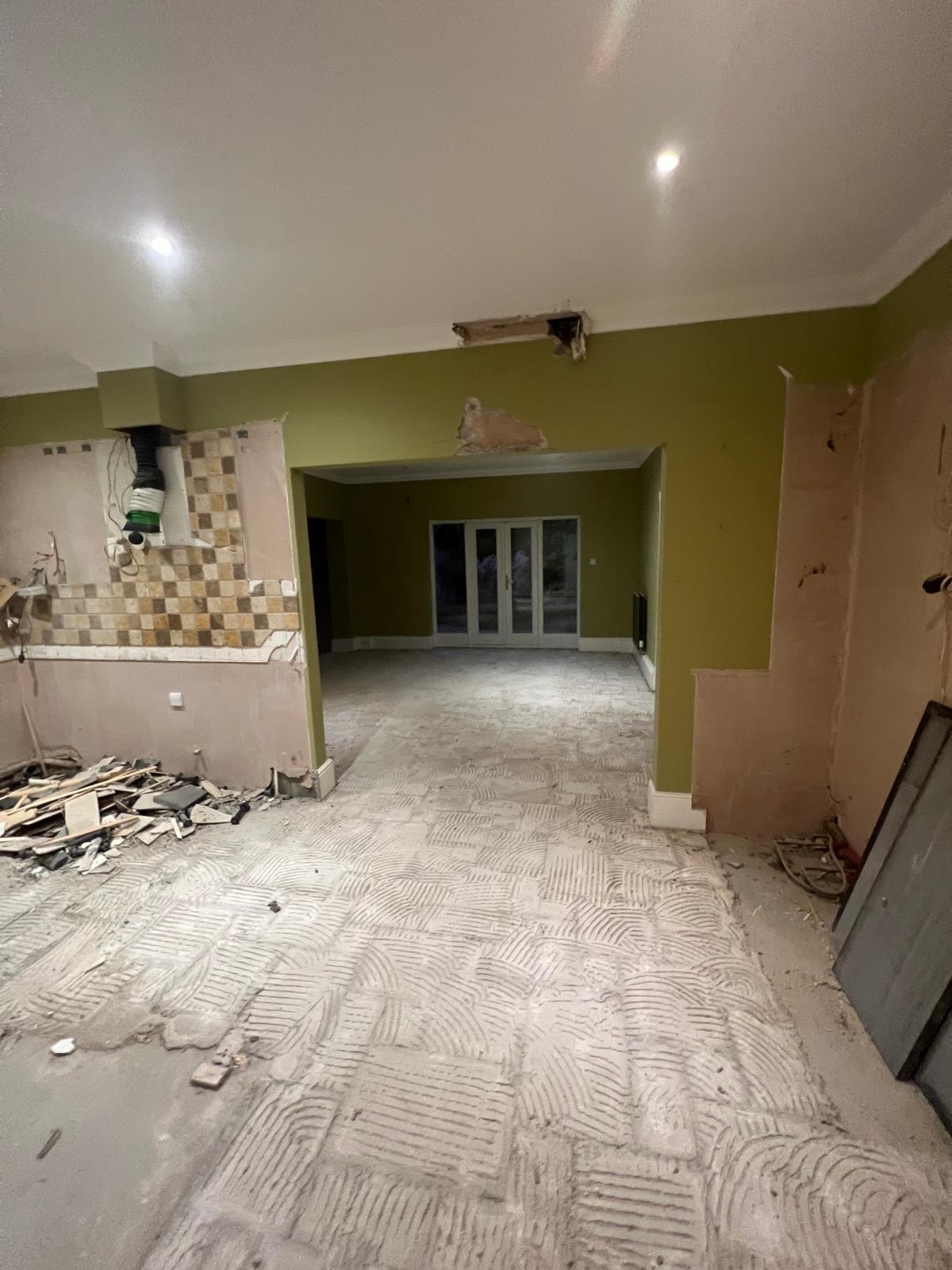 Exposed floor structure during the Oxshott strip-out.