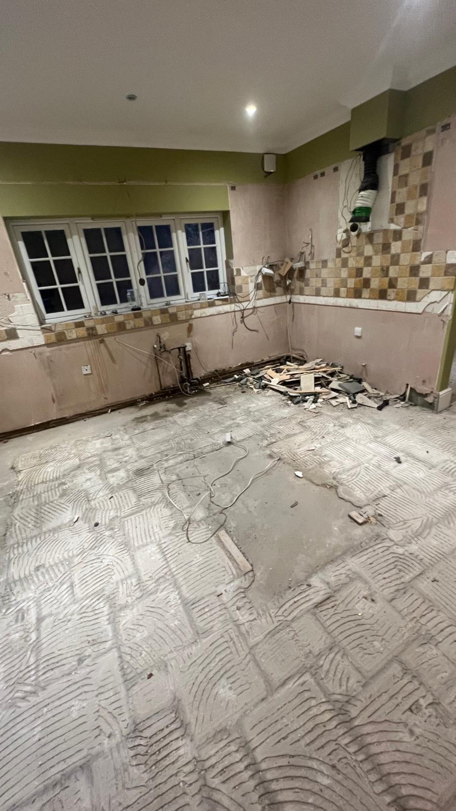 Floor and wall strip-out underway at the Oxshott property.