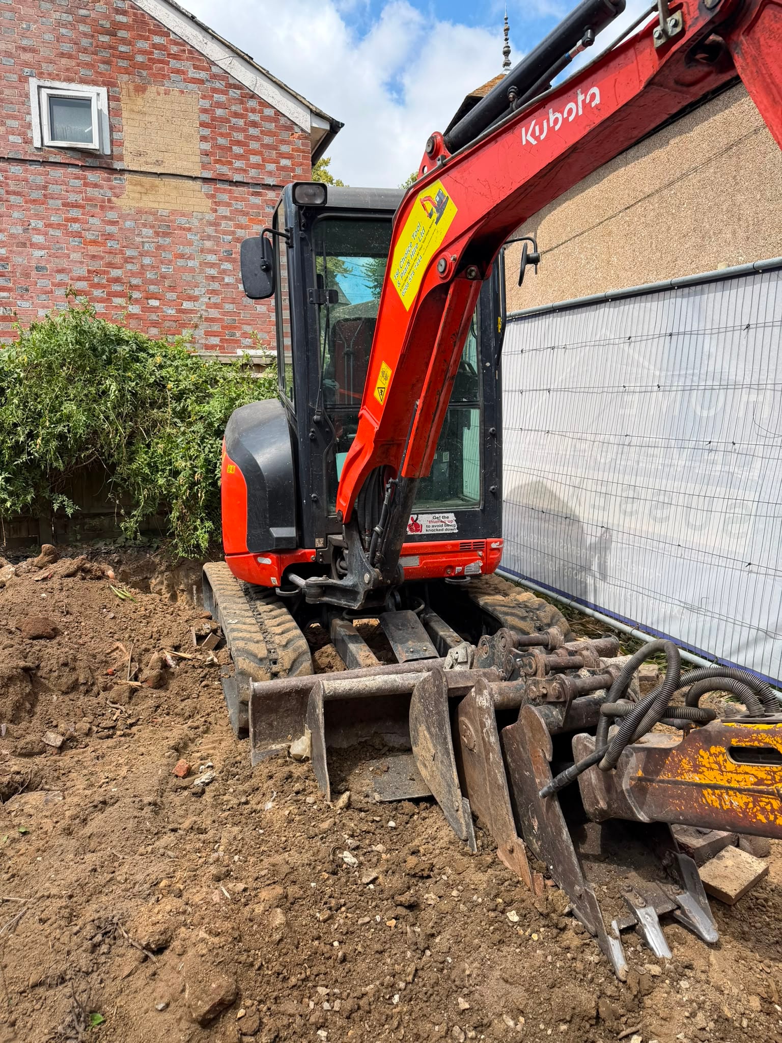 Excavator at work during the Pulborough extension demolition.