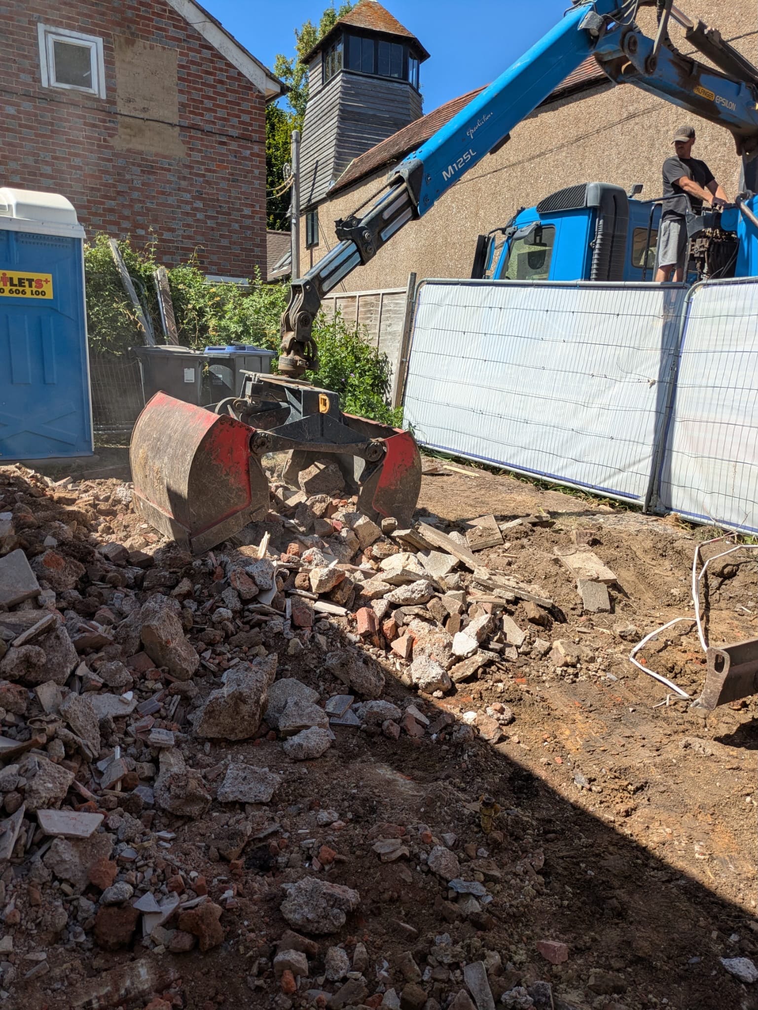 Excavator clearing the Pulborough extension site.