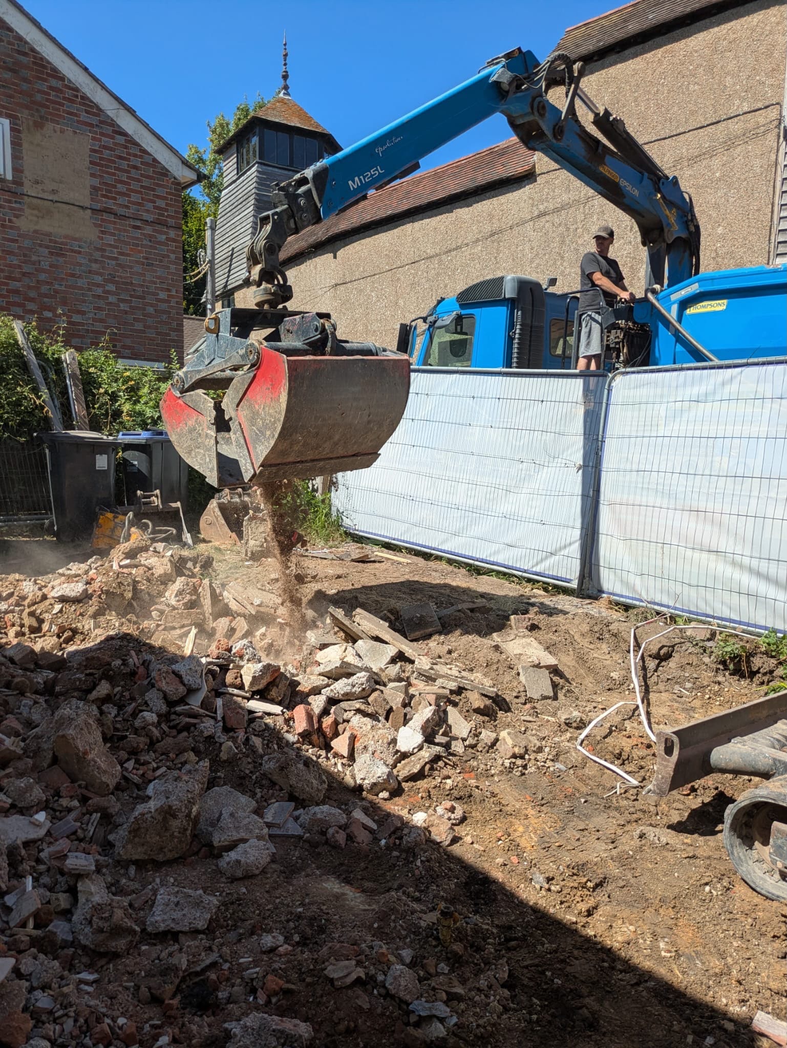 Grab loading during waste clearance at the Pulborough project.