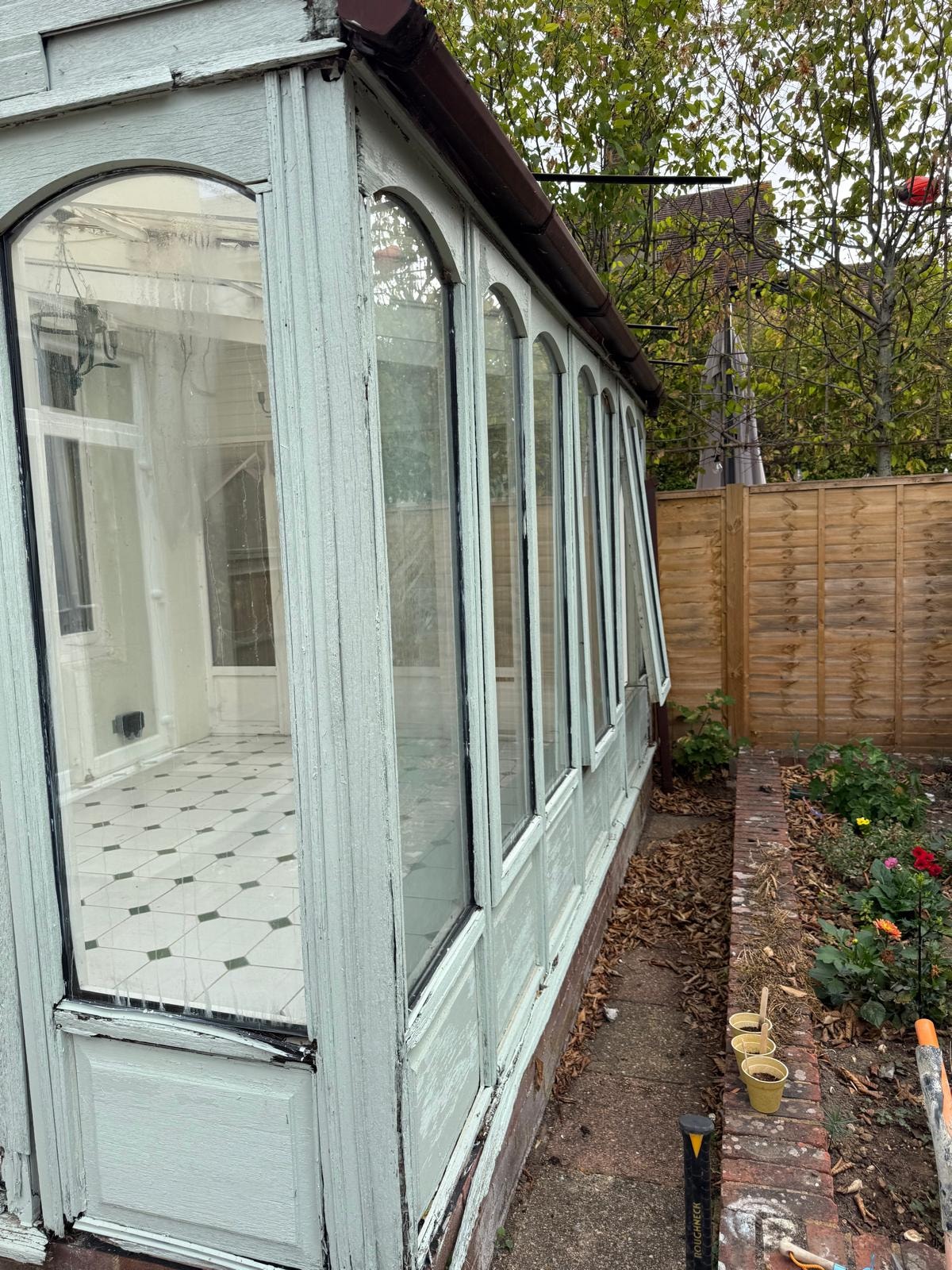 Narrow side access to the conservatory in Reigate before demolition