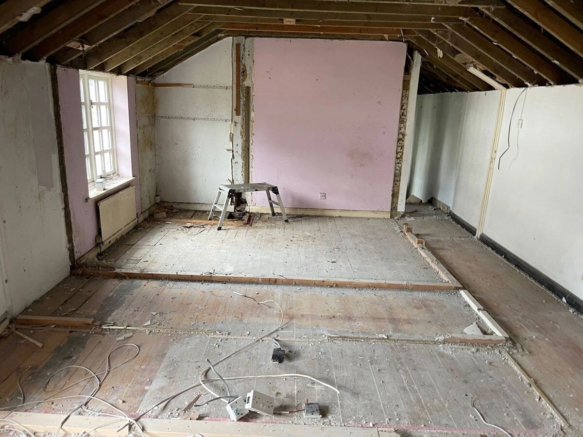 Interior of the Walton-on-Thames cottage during strip-out.