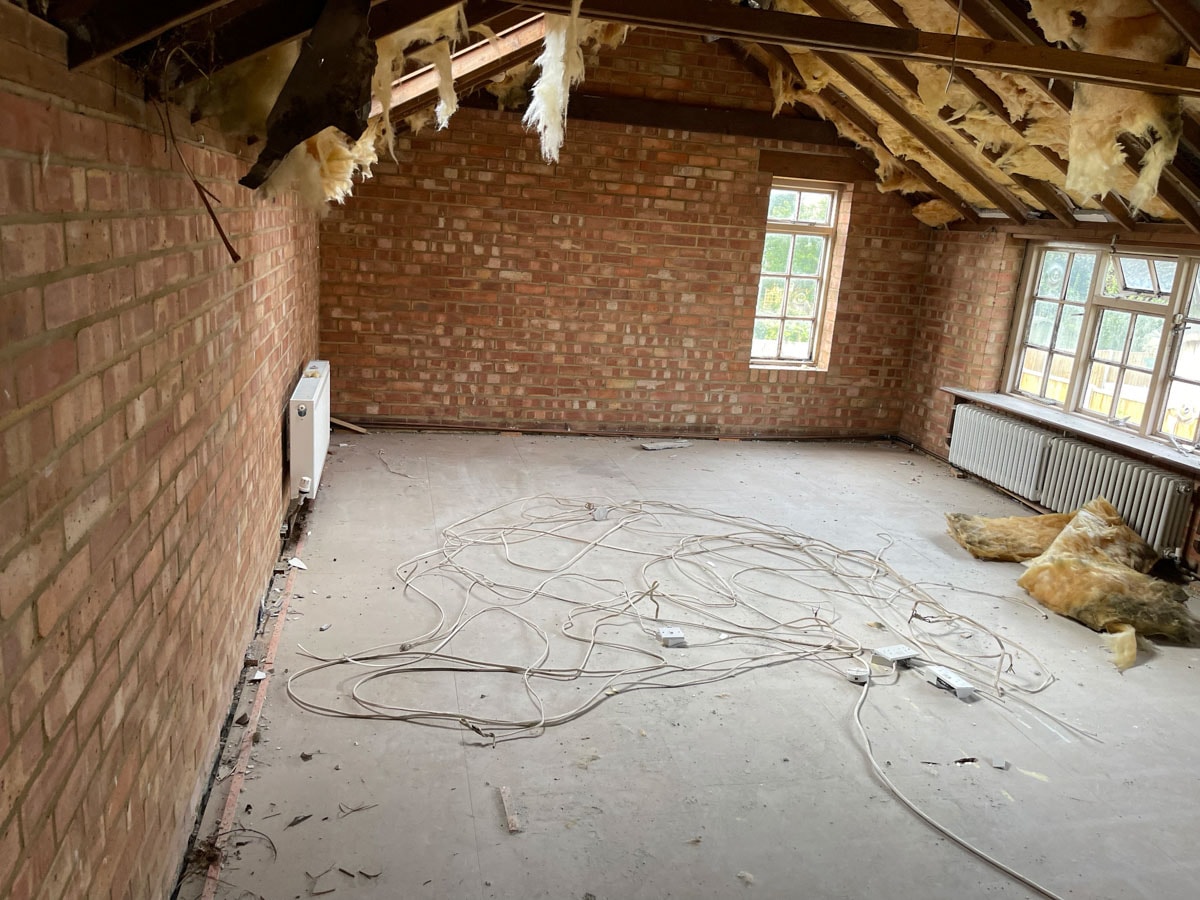 Interior of the Walton-on-Thames cottage before strip-out works.
