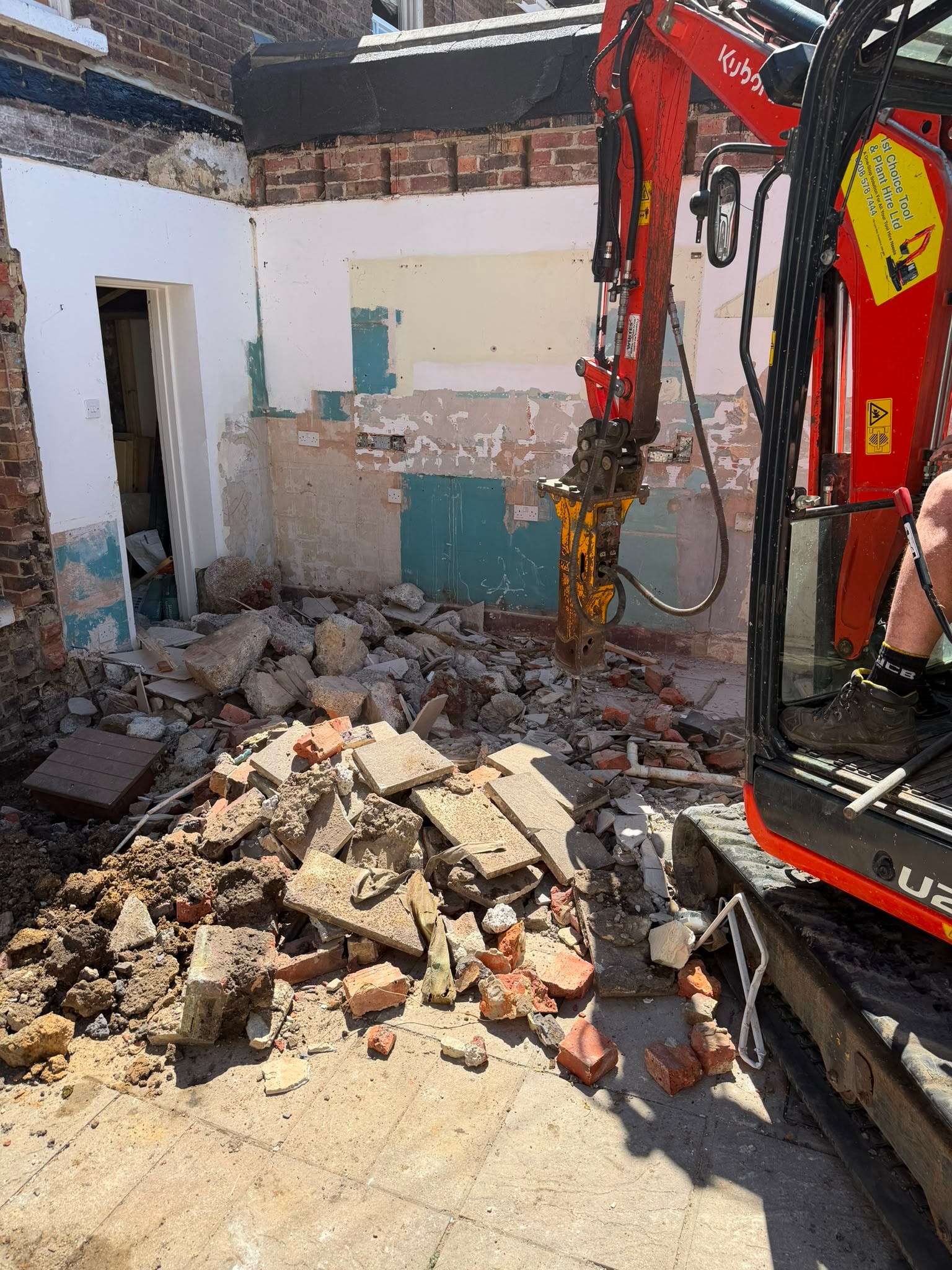 Breaker demolition work on concrete.
